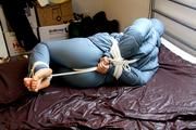 Jill tied and gagged in a shiny nylon oldschool skisuit