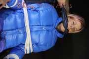 Sexy Pia being tied and gagged with ropes and a cloth gag on a hairdressers chair wearing a sexy blue shiny nylon rainpants and a lightblue downjacket (Pics)