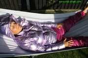 Watch Sandra enjoying the Summer in her shiny nylon Downwear