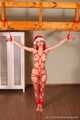 Morrigan - Red-haired girl in Santa’s hat pampers guys with bondage session