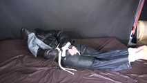 ***SEXY SONJA*** being tied and gagged on a bed with ropes and a clothgag wearing a sexy black shiny nylon down jacket and a black shiny nylon rain pants (Video)