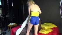 *** Sexy MIA wearing a blue shiny nylon shorts and a yellow top during changing the cloths on her bed  (Video)***