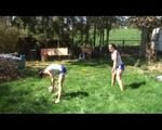 Jill and a friend of her playing soccer in the garden while wearing shiny nylon shorts (Video)