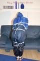 Jill tied, gagged and hooded wearing shiny nylon rainwear (Pics)