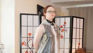 Lady Nadja is bound and gagged in a nice PVC dress and a transparent raincoat trying to escape