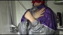 Mara wearing a sexy purple/silver pvc combination tied and gagged on a shower (Video)