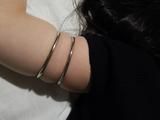 Ranias upper arms and the metal rings