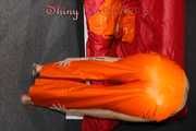 Watching Pia putting on a wonderful supersexy shiny nylon rainssuit in orange (Pics)