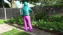 Watching Sandra taking a sun bath and watering the garden the pest plants wearing a sexy purple rain pants and a green down jacket (Video)