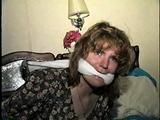 28 YEAR OLD HOUSEWIFE IS BALL-GAGGED, CLEAVE GAGGED, HANDGAGGED, HANDCUFFED & TIED UP ON THE BED (D63-8)