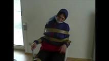 3sets of short videos with Katharina tied and gagged and hooded on a chair wearing shiny nylon rainwear (Video)