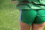 Watching sexy Sandra wearing a sexy green shiny nylon shorts and a green shiny nylon rain jacket enjoying the garden shower (Pics)