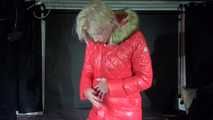 Watching sexy Pia puttng on a special red down jacket (Video)