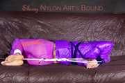 *** HOT HOT HOT*** NEW MODELL*** SANDRA wearing a sexy transparent purple shiny nylon pants and a purple down jacket tied and gagged on a sofa with ropes hand to feet and a cloth gag (Pics)