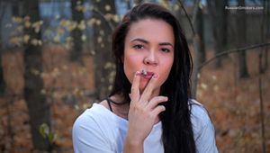 Gorgeous fitness trainer Tanya is smoking 120mm cork cigarette in the park