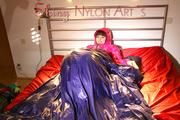 Mara in bed wearing supersexy pink shiny nylon downjacket with hood and a rain pants (Pics)