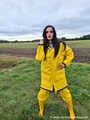 Miss Amira on the road in a Frisian mink, yellow rain dungarees and rubber boots