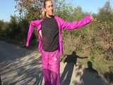 Watch Sandra riding her Bike in her sexy pink shiny nylon Rainsuit