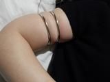 Ranias upper arms and the metal rings