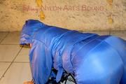 Jill tied, gagged anmd hooded with old handcuffs lying in an old cellar wearing a sexy lightblue skibib (Pics)