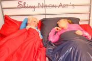 Jenny and Yvonne putting clean sheets on the bed wearing shiny nylon shorts and rain jacket (Pics)
