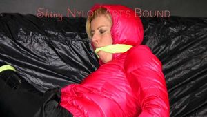 Pia wearing a sexy black rain pants and a pink down jacket being tied and gagged with cloths (Pics)