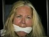 38 Yr OLD CASHIER IS CLEAVE GAGGED, HAS MOUTH STUFFED WITH STINKY NYLON STOCKINGS, DUCT TAPE GAGGED & BAREFOOT (D55-12)