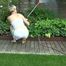 Sexy Sonja wearing a *white* shiny nylon shorts with a white top durig watering the garden (Video)