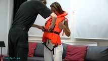 Senta its trying a life jacket and her handcuffs