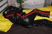 Watching sexy Lucy preparing her bivouac in shiny nylon linen wearing a supersexy black/red oldschool downsuit (Pics)