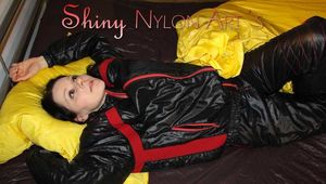 Watching sexy Lucy preparing her bivouac in shiny nylon linen wearing a supersexy black/red oldschool downsuit (Pics)