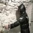 Archive girl tied, gagged and hooded in a cellar wearing a shiny black downcoat (Video)