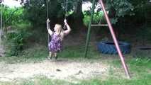 Miri cuffed on a swing