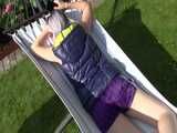 Watch Chloe enjoying her shiny nylon Downwear outside at a sunny Day