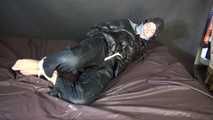 ***SEXY SONJA*** being tied and gagged on a bed with ropes and a clothgag wearing a sexy black shiny nylon down jacket and a black shiny nylon rain pants (Video)