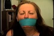 46 Yr OLD REAL ESTATE AGENT'S IS MOUTH STUFFED, HANDGAGGED, BANDANNA CLEAVE AND OTM GAGGED, ROPE GAGGED WITH HANDS TIGHTLY TIED WITH THIN RAWHIDE (D72-10)