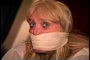 50 Yr OLD REAL ESTATE AGENT GETS MOUTH STUFFED, VET TAPE WRAP GAGGED, BAREFOOT, BALL-TIED, TOE-TIED, HANDGAGGED, GAG TALKING AND NECK AND BODY TICKLED (D74-13)