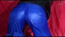 Watching Sonja preparing her sofa wearing a supersexy blue shiny nylon raver pant and a black down jacket (Video)