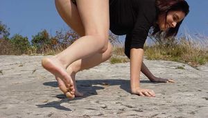 Naked sunbathing on a hill side