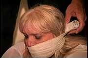 50 Yr OLD REAL ESTATE AGENT GETS MOUTH STUFFED, VET TAPE WRAP GAGGED, BAREFOOT, BALL-TIED, TOE-TIED, HANDGAGGED, GAG TALKING AND NECK AND BODY TICKLED (D74-13)
