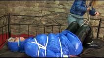 Pia tied, gagged and hooded on a princess bed in an old cellar wearing a sexy shiny down coat, down pants and down boots (Video)
