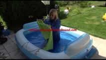 Pia ties and gagges herself in a small swimming pool wearing sexy lightblue downwear (Video)
