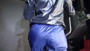 Watching sexy SONJA wearing a sexy black/blue rainwear combination and trainers during her workout (Video)