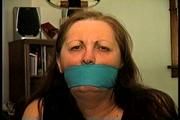 46 Yr OLD REAL ESTATE AGENT'S IS MOUTH STUFFED, HANDGAGGED, BANDANNA CLEAVE AND OTM GAGGED, ROPE GAGGED WITH HANDS TIGHTLY TIED WITH THIN RAWHIDE (D72-10)