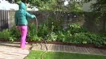 Watching Sandra taking a sun bath and watering the garden the pest plants wearing a sexy purple rain pants and a green down jacket (Video)