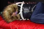 Sonja being tied, gagged and hooded on a shiny nylon bed with ropes and a clothgag wearing a supersexy shiny nylon rain pants and a black down jacket with fur (Pics)