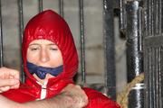 Katharina tied and gagged in a shiny nylon downjacket