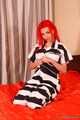 Morrigan - Redhead plays the role of a submissive girl in a prison uniform