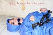 Jill tied, gagged anmd hooded with old handcuffs lying in an old cellar wearing a sexy lightblue skibib (Pics)