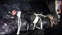 Sexy Sandra wearing a black downwear combination being tied, gagged and hooded with ropes and clothgag on a sofa (Video)